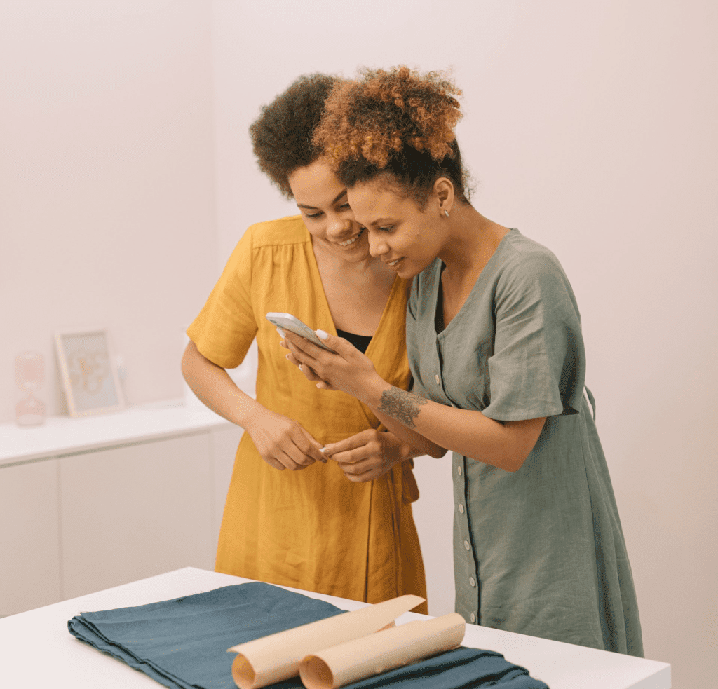 coworkers leaning over a phone